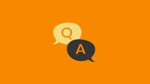 Landscape image of two speech bubbles on an orange background. One speech bubble is yellow with an orange 'Q' in the middle. One speech bubble is black with an orange 'A' in the middle.