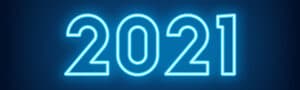 A landscape image of the number (and year) 2021. The background is dark blue and the numbers are in a neon white.