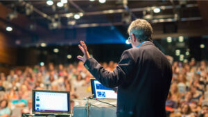 man presenting in front of audience