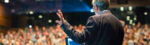 man presenting in front of audience