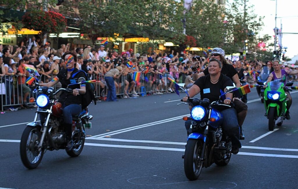 Megan on a motorbike at Pride event