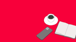 A book, a mobile phone and a coffee cup on a red background