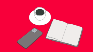 A book, a mobile phone and a coffee cup on a red background