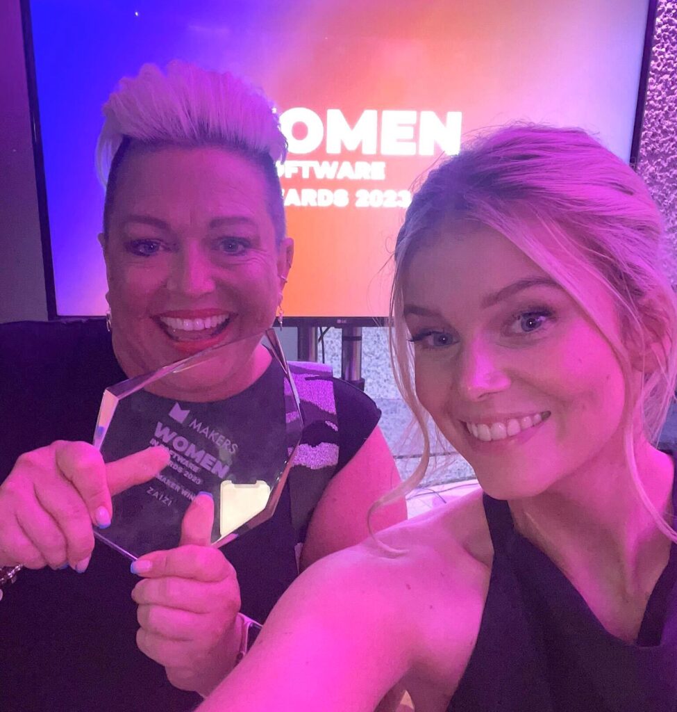 Tracey and Emily celebrating with the award
