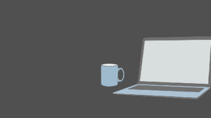 An open laptop with a coffee mug next