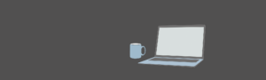 An open laptop with a coffee mug next