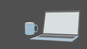 An open laptop with a coffee mug next to it